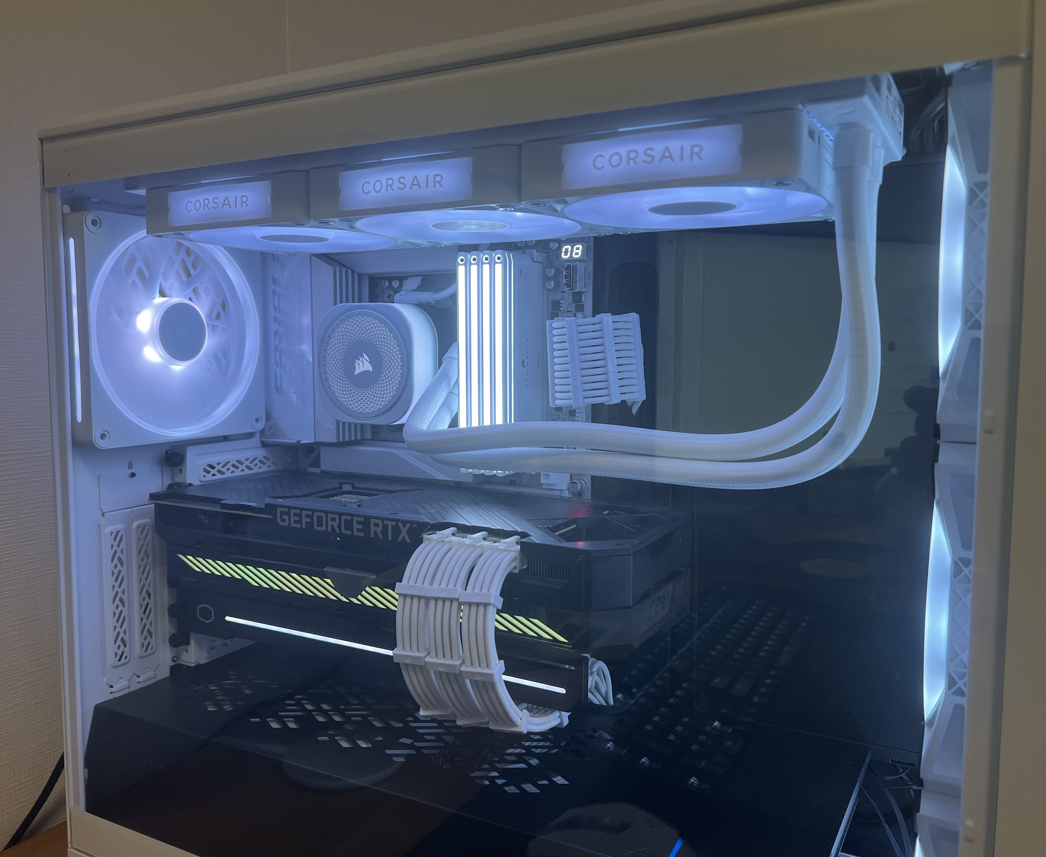 Custom all-white gaming PC build featuring Ryzen 7 7800X3D, Gigabyte X870E AORUS ICE motherboard, Corsair cooling, and ROG Strix RTX 3080